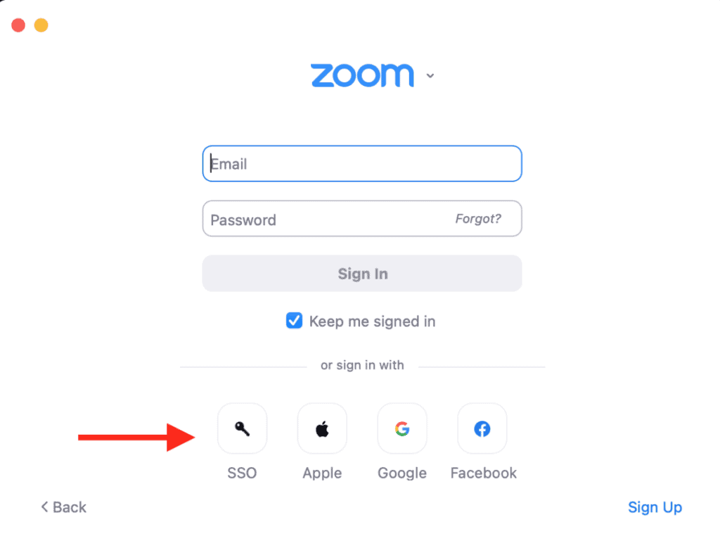 Zoom log in page with a red arrow point to the sign in with SSO option